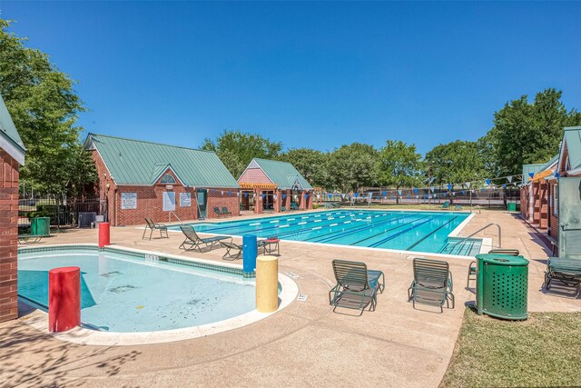 7210 Welshwood Ln, Sugar Land, TX 77479 - community pool featuring a patio area
