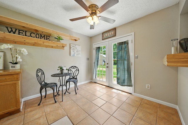 17715 Butera Rd, Magnolia, TX 77355 - dining room with french doors, light tile patterned floors, a ceiling fan, and a textured ceiling