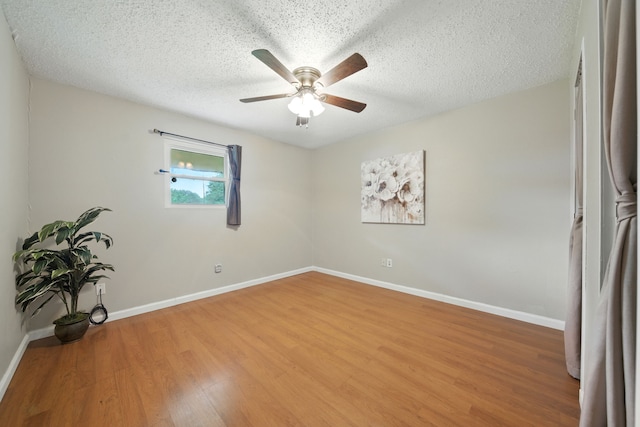 17715 Butera Rd, Magnolia, TX 77355 - unfurnished room featuring light wood finished floors, ceiling fan, and a textured ceiling