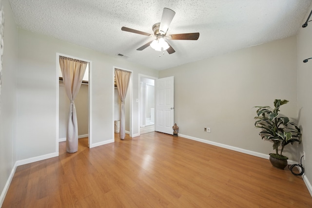 17715 Butera Rd, Magnolia, TX 77355 - unfurnished bedroom featuring light wood finished floors, a textured ceiling, and a ceiling fan
