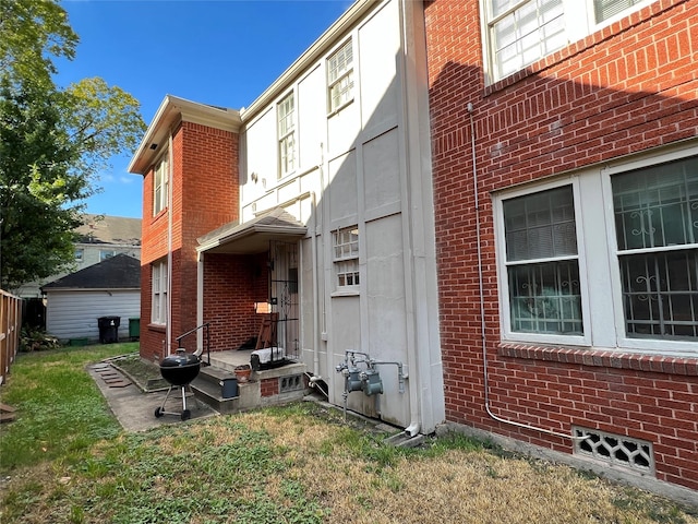 4905 Jackson St, Houston, TX 77004 - view of side of home with brick siding and a yard