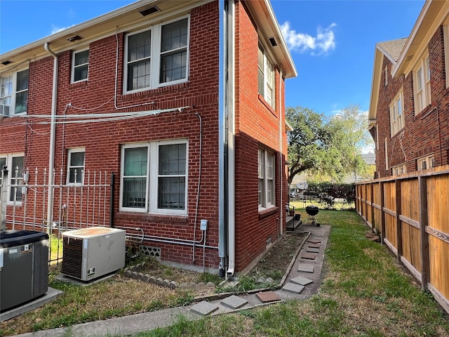 4905 Jackson St, Houston, TX 77004 - view of side of home featuring a central AC unit and brick siding