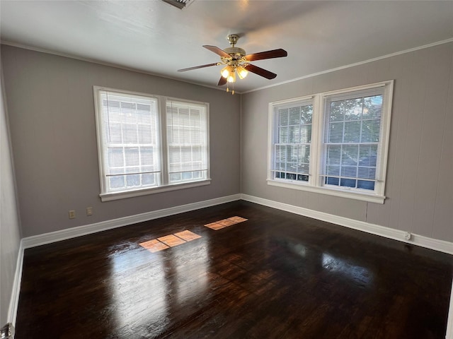 4905 Jackson St, Houston, TX 77004 - spare room featuring a ceiling fan, dark wood-type flooring, and ornamental molding