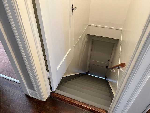 4905 Jackson St, Houston, TX 77004 - stairway featuring wood finished floors, wainscoting, and a decorative wall