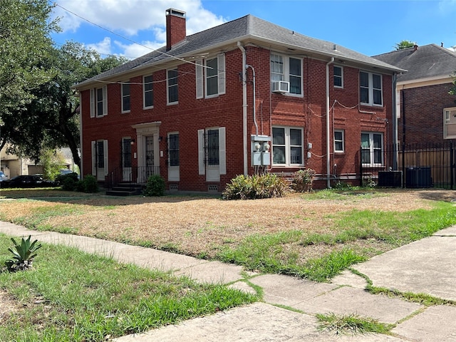 4905 Jackson St, Houston, TX 77004 - view of front of property featuring a chimney, brick siding, and cooling unit