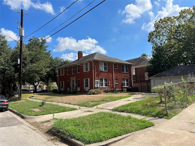 4905 Jackson St, Houston, TX 77004 - view of front of property featuring a chimney, brick siding, and a garage