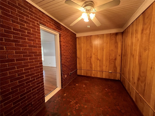 4905 Jackson St, Houston, TX 77004 - spare room featuring ceiling fan, crown molding, brick wall, and wooden walls