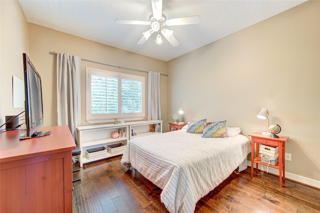 1415 Baldwin Square Ln, Houston, TX 77077 - bedroom with dark wood-type flooring, a ceiling fan, and a desk