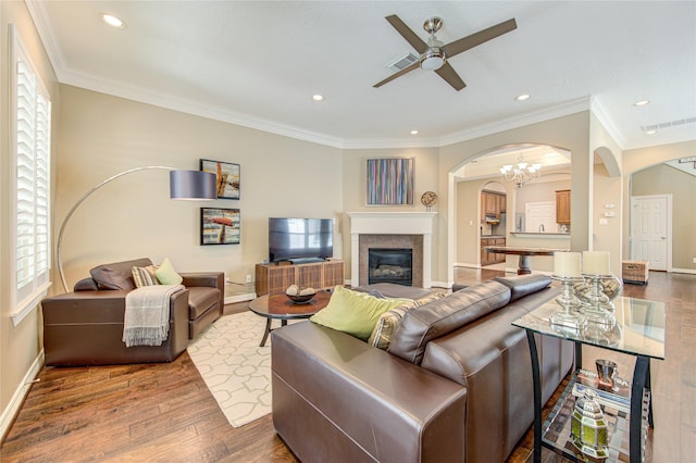 1415 Baldwin Square Ln, Houston, TX 77077 - living room featuring arched walkways, ceiling fan, wood finished floors, recessed lighting, and healthy amount of natural light