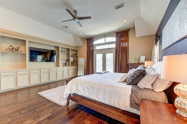 1415 Baldwin Square Ln, Houston, TX 77077 - bedroom featuring french doors, multiple windows, wood finished floors, a textured ceiling, and vaulted ceiling
