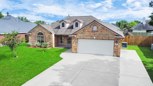 204 Audubon Woods Ct, Richwood, TX 77531 - view of front of property featuring brick siding, concrete driveway, an attached garage, and roof with shingles