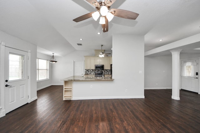 204 Audubon Woods Ct, Richwood, TX 77531 - unfurnished living room featuring ceiling fan, dark wood-type flooring, lofted ceiling, recessed lighting, and ornate columns