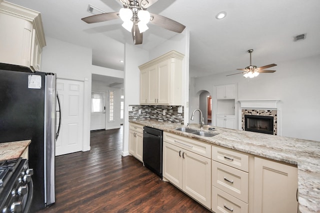 204 Audubon Woods Ct, Richwood, TX 77531 - kitchen featuring black appliances, ceiling fan, dark wood-type flooring, recessed lighting, and backsplash