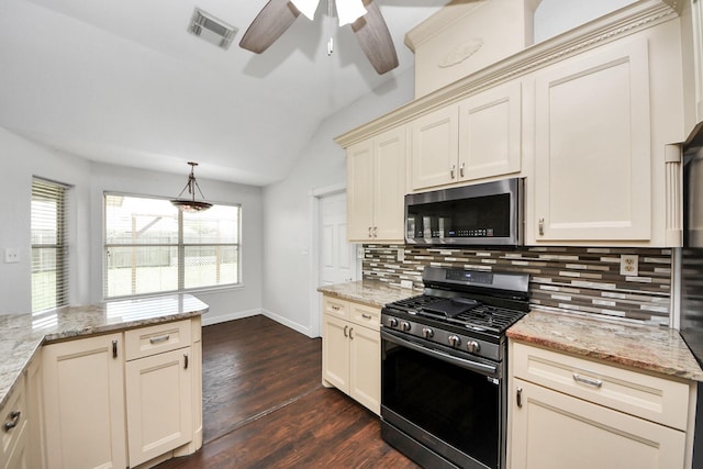 204 Audubon Woods Ct, Richwood, TX 77531 - kitchen with appliances with stainless steel finishes, a ceiling fan, decorative backsplash, vaulted ceiling, and dark wood-style floors