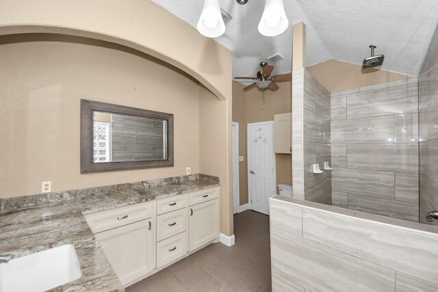 204 Audubon Woods Ct, Richwood, TX 77531 - bathroom with vanity, ceiling fan, tiled shower, and tile patterned flooring