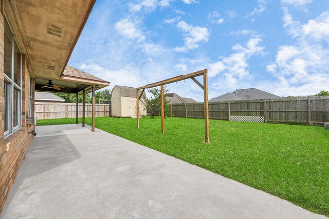204 Audubon Woods Ct, Richwood, TX 77531 - fenced backyard featuring ceiling fan, a storage shed, and a patio area