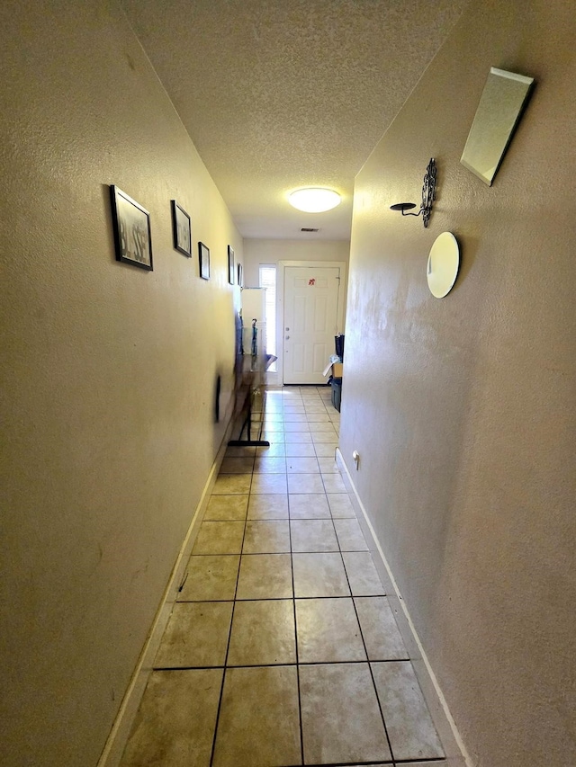 17910 Alee Ct, Crosby, TX 77532 - hall featuring a textured ceiling and light tile patterned flooring