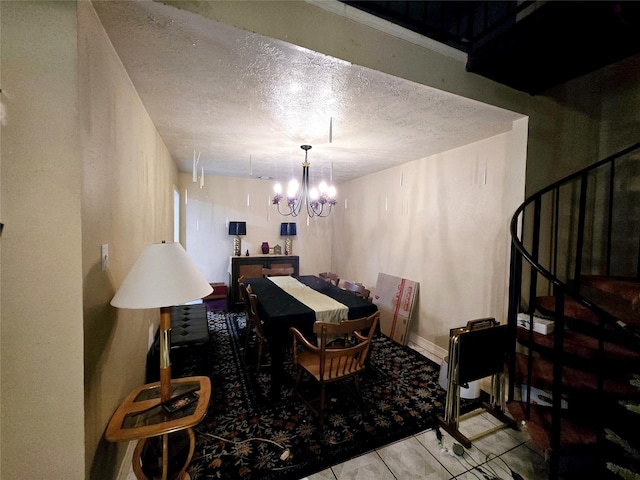 17415 Mallett St, Crosby, TX 77532 - tiled dining space featuring a textured ceiling, stairs, and a chandelier