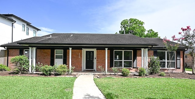 5035 Yarwell Dr, Houston, TX 77096 - ranch-style home with brick siding, a porch, a front yard, and a shingled roof