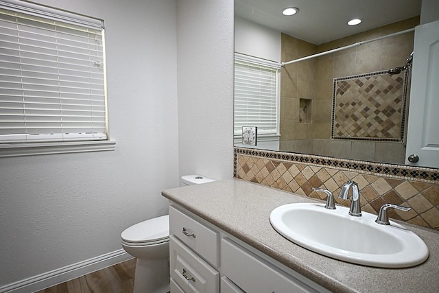 5035 Yarwell Dr, Houston, TX 77096 - full bath featuring vanity, decorative backsplash, a tile shower, wood finished floors, and recessed lighting
