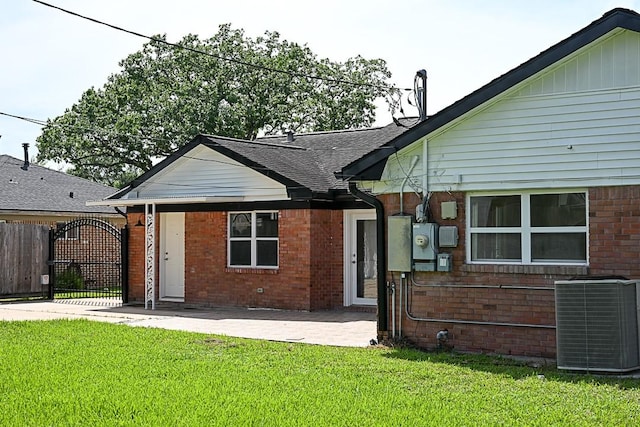 5035 Yarwell Dr, Houston, TX 77096 - rear view of house featuring brick siding, a gate, and a patio area