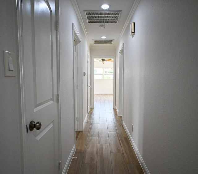 5035 Yarwell Dr, Houston, TX 77096 - hall with wood finished floors, ornamental molding, and a textured wall