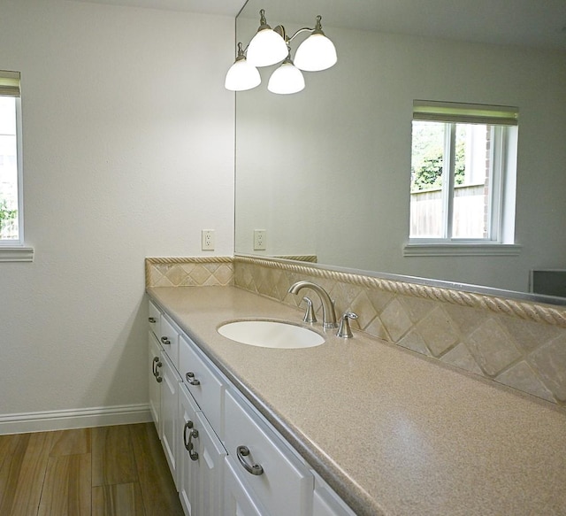 5035 Yarwell Dr, Houston, TX 77096 - bathroom with vanity, wood finished floors, and a chandelier