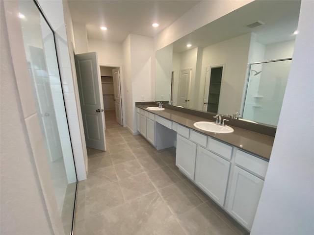17910 Rillette Rd, Conroe, TX 77302 - full bathroom featuring a stall shower, a spacious closet, double vanity, tile patterned flooring, and recessed lighting