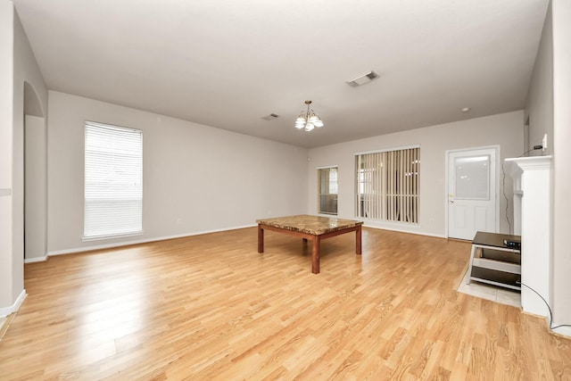 24219 Camillia Ridge Way, Katy, TX 77493 - rec room with a chandelier, light wood-type flooring, and plenty of natural light