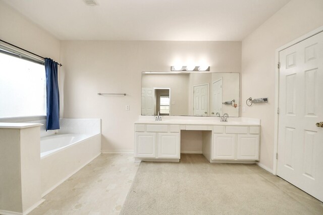 24219 Camillia Ridge Way, Katy, TX 77493 - full bathroom with double vanity, a bath, and carpet