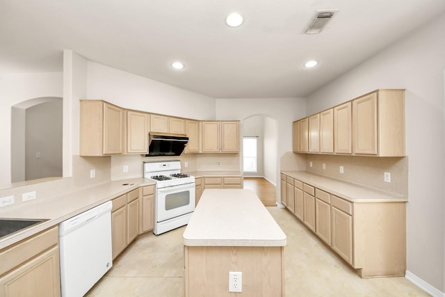 24219 Camillia Ridge Way, Katy, TX 77493 - kitchen with white appliances, light brown cabinets, light countertops, a kitchen island, and recessed lighting