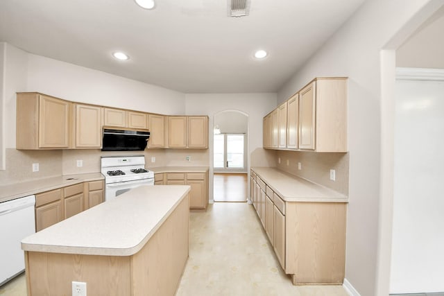 24219 Camillia Ridge Way, Katy, TX 77493 - kitchen with white appliances, light brown cabinetry, arched walkways, light countertops, and recessed lighting