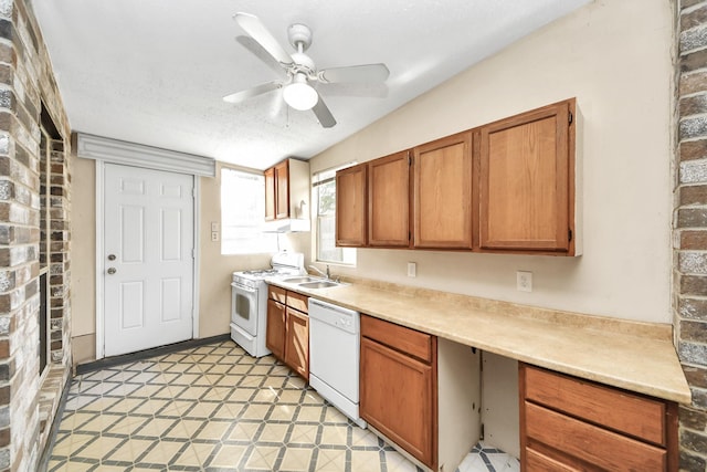 24219 Camillia Ridge Way, Katy, TX 77493 - kitchen featuring white appliances, ceiling fan, light countertops, brown cabinetry, and a textured ceiling