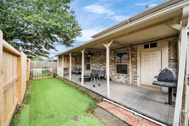 24219 Camillia Ridge Way, Katy, TX 77493 - fenced backyard featuring ceiling fan, a patio area, an outdoor hangout area, and a wooden deck