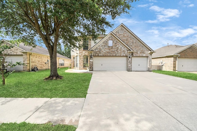 24219 Camillia Ridge Way, Katy, TX 77493 - view of front facade featuring a front yard, concrete driveway, and an attached garage