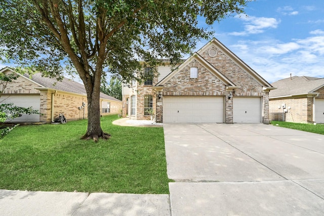 24219 Camillia Ridge Way, Katy, TX 77493 - view of front of house with a front yard, concrete driveway, a garage, and brick siding