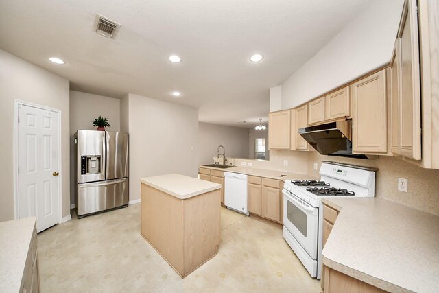 24219 Camillia Ridge Way, Katy, TX 77493 - kitchen with white appliances, light brown cabinetry, under cabinet range hood, recessed lighting, and light countertops