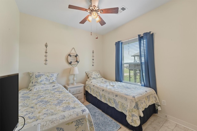 2577 Holiday Dr, Crystal Beach, TX 77650 - bedroom with baseboards and a ceiling fan