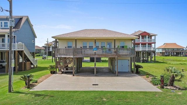 2577 Holiday Dr, Crystal Beach, TX 77650 - back of property with a carport, stairs, driveway, a lawn, and roof with shingles