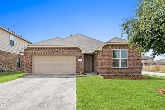 9127 Sasson Blvd, Houston, TX 77044 - view of front facade with driveway, a garage, brick siding, and roof with shingles