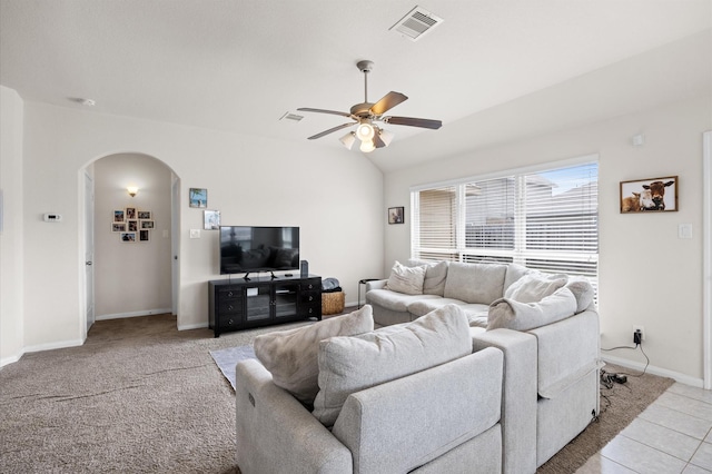 9127 Sasson Blvd, Houston, TX 77044 - living room featuring arched walkways, a ceiling fan, vaulted ceiling, and light tile patterned flooring