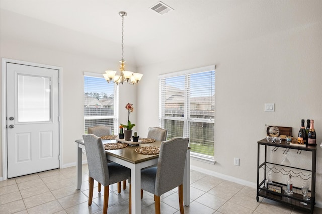 9127 Sasson Blvd, Houston, TX 77044 - dining area with a chandelier, plenty of natural light, light tile patterned floors, and lofted ceiling