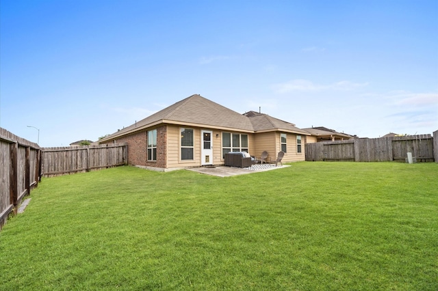 9127 Sasson Blvd, Houston, TX 77044 - rear view of house with a fenced backyard, a patio, and an outdoor living space