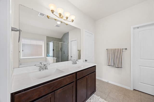 9127 Sasson Blvd, Houston, TX 77044 - full bath featuring a shower stall, double vanity, tile patterned floors, a chandelier, and lofted ceiling