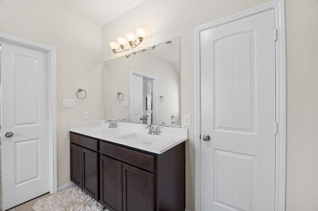 9127 Sasson Blvd, Houston, TX 77044 - full bathroom with double vanity and a chandelier