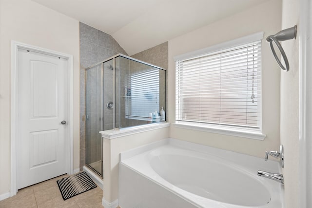 9127 Sasson Blvd, Houston, TX 77044 - bathroom featuring a garden tub, a stall shower, tile patterned floors, plenty of natural light, and vaulted ceiling