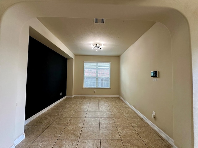 22411 Limestone Crest Ln, Katy, TX 77449 - unfurnished room with a textured ceiling and light tile patterned flooring