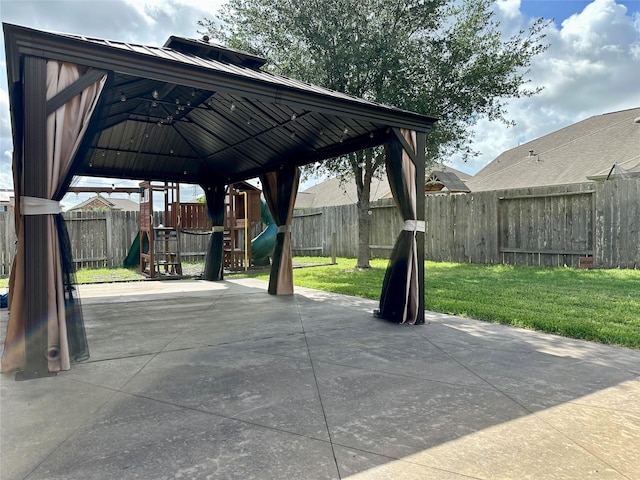 22411 Limestone Crest Ln, Katy, TX 77449 - fenced backyard with a playground and a patio area