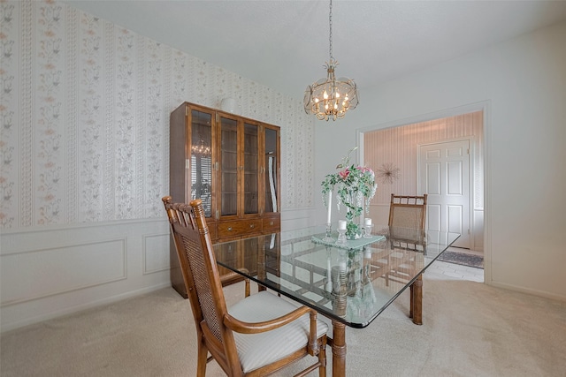 17718 Terrawren Ln, Spring, TX 77379 - carpeted dining space with a chandelier, wallpapered walls, and wainscoting