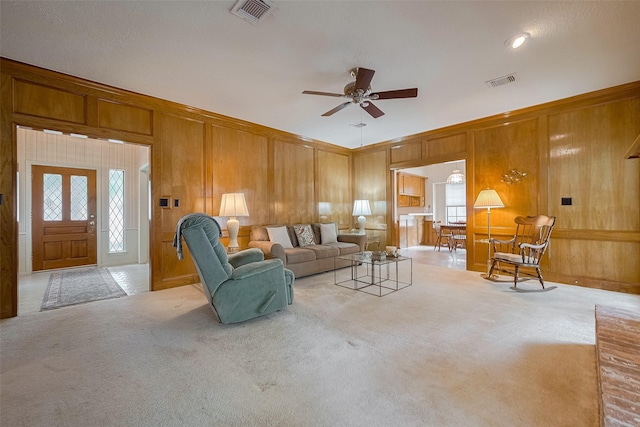 17718 Terrawren Ln, Spring, TX 77379 - carpeted living area with a ceiling fan and wood walls
